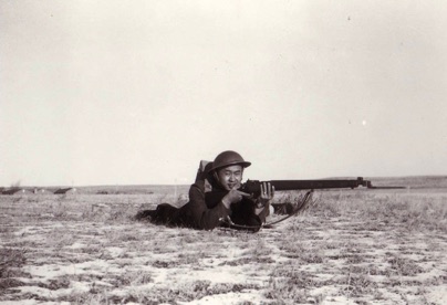 Willie Chong with a rifle during basic training