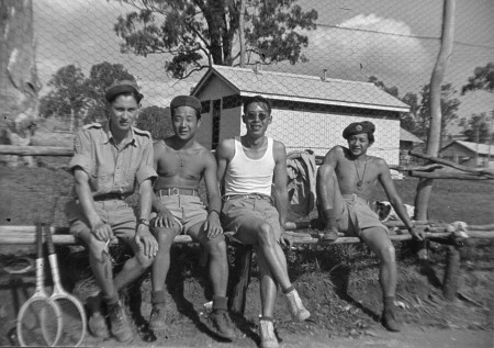 Harden Lee (second from left) enjoys a break playing tennis. 