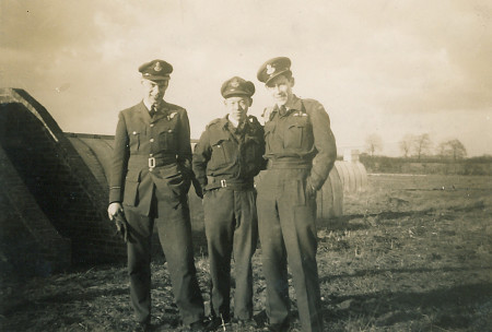 Photo of RCAF crew of DV-245 Lancaster MK III. Individuals left to right are F/O Wm. Brooks (Edmonton, AB), F/O Jim Gen Lee (Winnipeg, MB), F/O Ralph Robert Little (Lockport, NY).