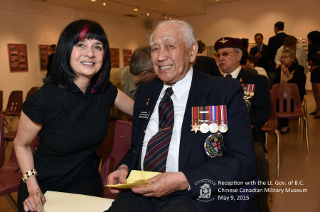 Curator and exhibition designer Catherin Clement chats with WWII veteran Neil Chan.