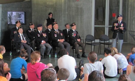 Chinese Canadian veterans meet with high school students and share their stories of the double victory. 