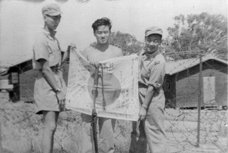 At Liverpool Rest Camp: Eddie Chow in the middle