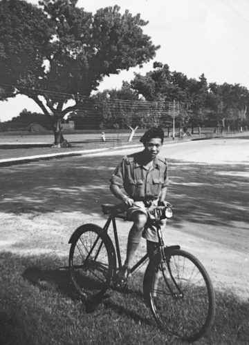 Young Ming (James) Wong in India with a bicycle